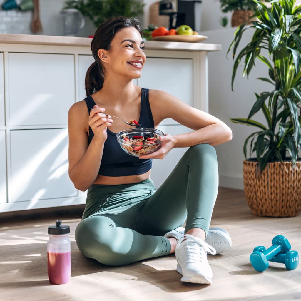 Active woman eating healthy breakfast